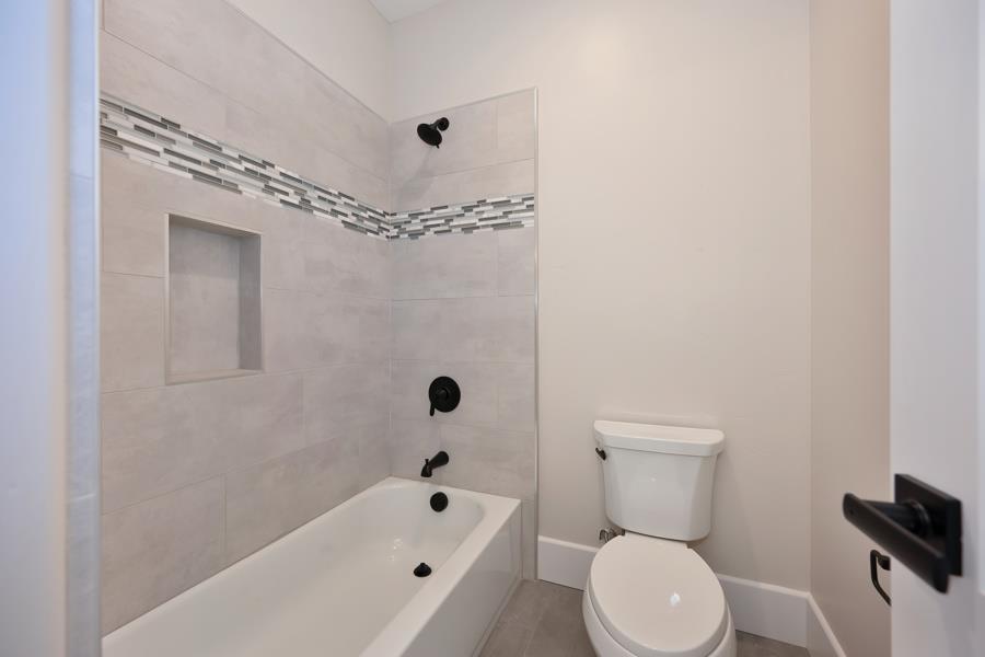 3301 Stone Field Way Loomis, CA 95650 - Photo 31 of 33 a bathroom with a toilet a sink and bathtub