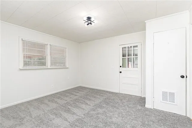 a view of empty room with windows