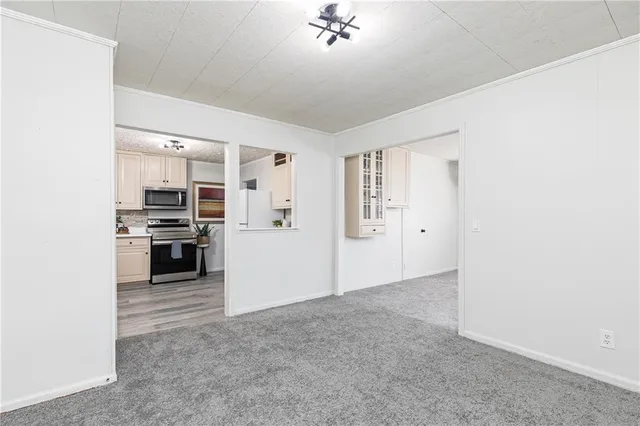 a view of a kitchen with a sink and a stove top oven