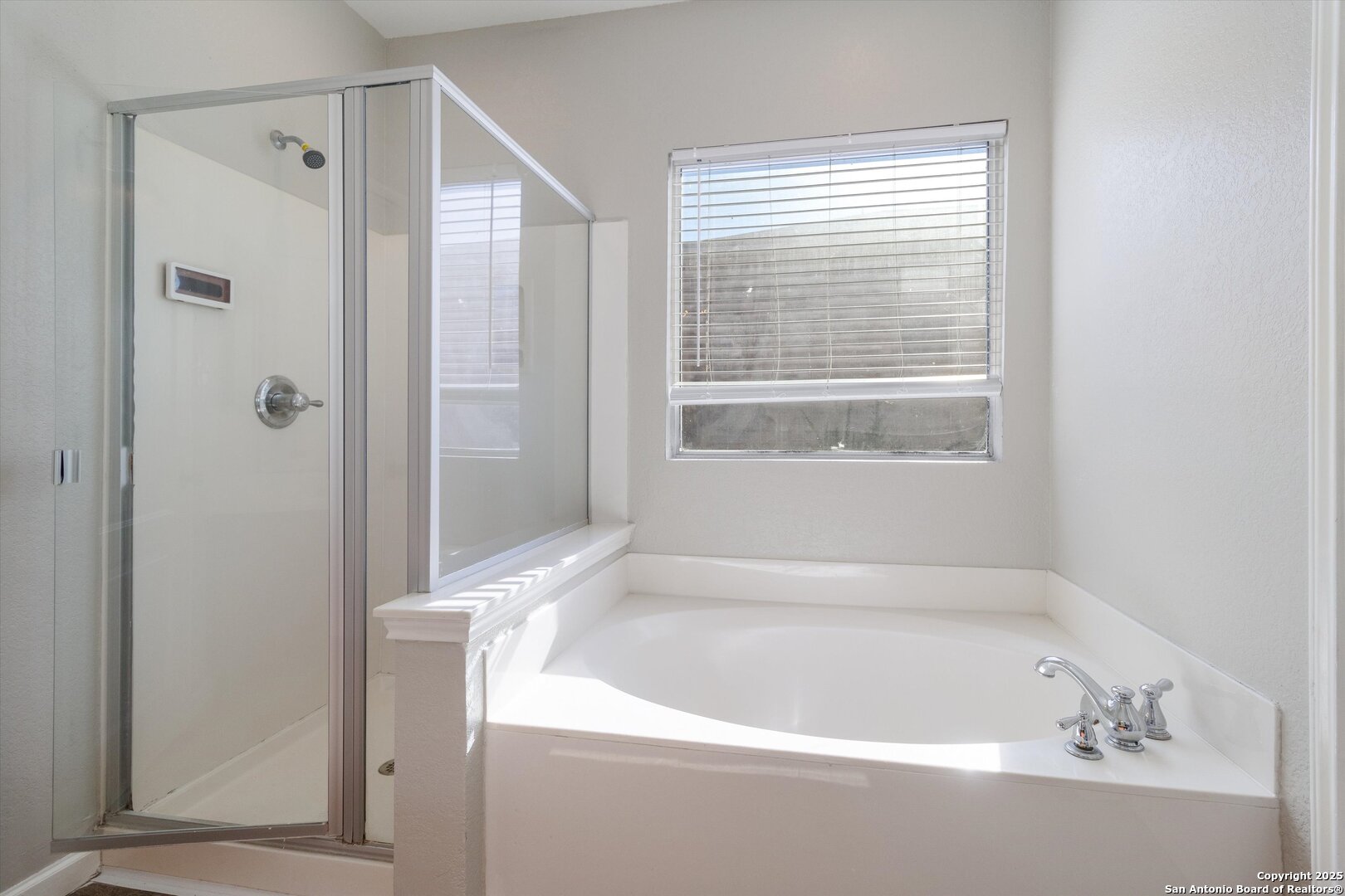 13506 Misty View San Antonio, TX 78245 - Photo 17 of 29 a white bath tub sitting next to a window