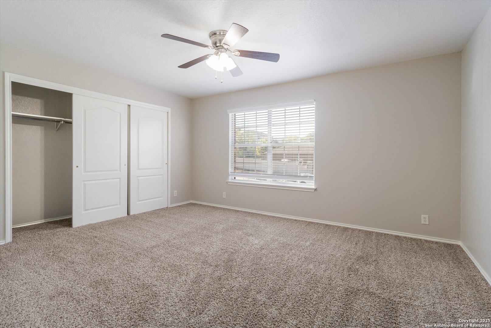 13506 Misty View San Antonio, TX 78245 - Photo 20 of 29 an empty room with windows and fan