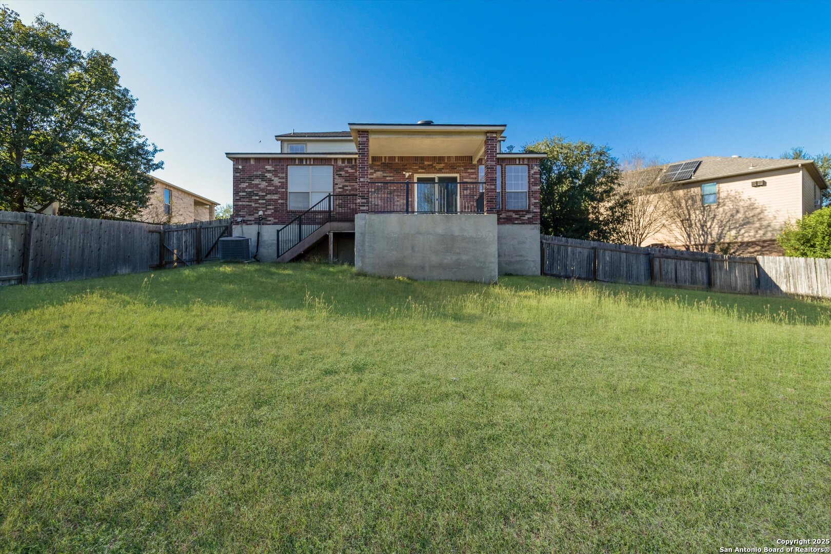 13506 Misty View San Antonio, TX 78245 - Photo 28 of 29 a view of a house with a yard and a patio