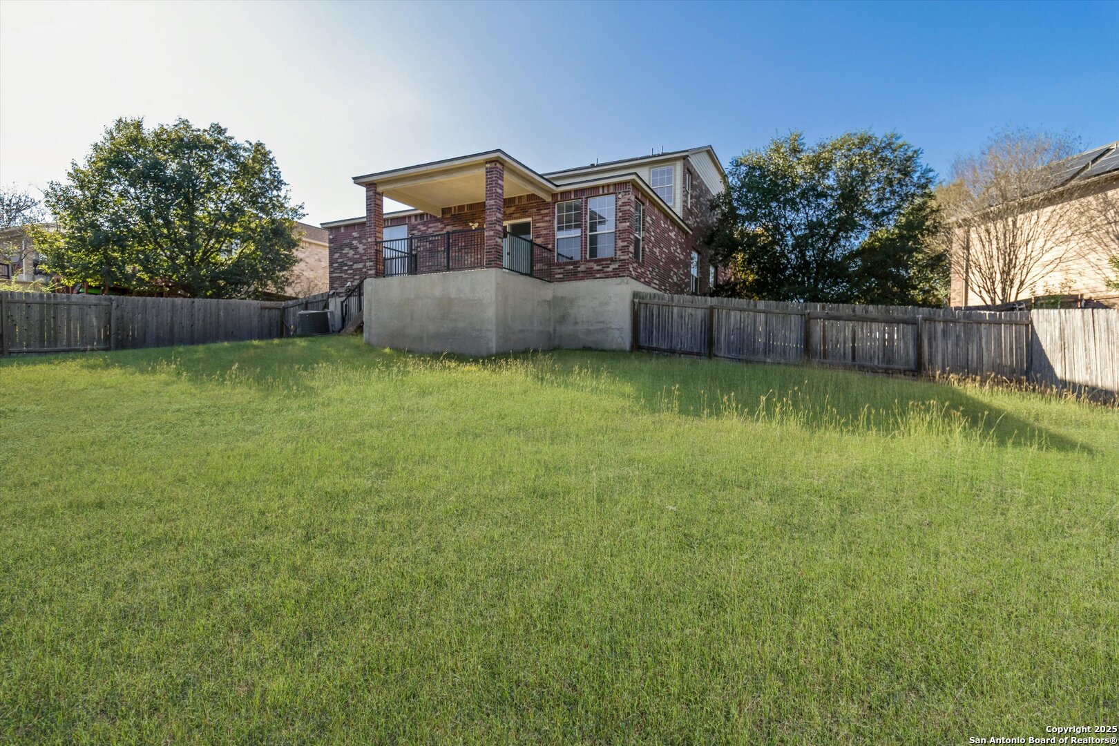 13506 Misty View San Antonio, TX 78245 - Photo 29 of 29 a backyard of a house with lots of green space