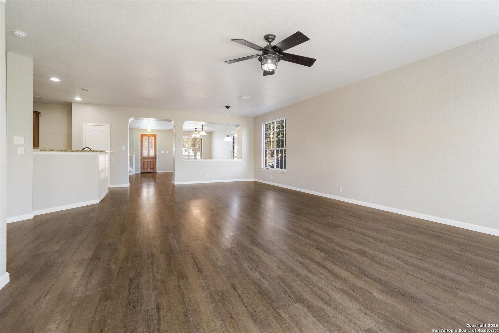 13506 Misty View San Antonio, TX 78245 - Photo 8 of 29 a view of an empty room with wooden floor and a window