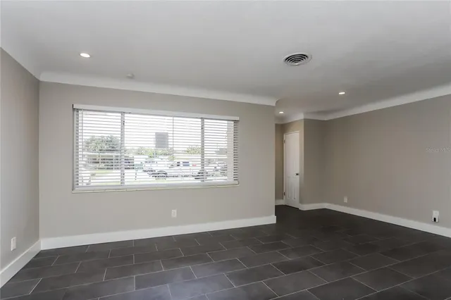 a view of an empty room with a window