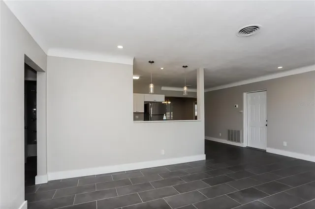 a view of a kitchen with a sink and a stove top oven