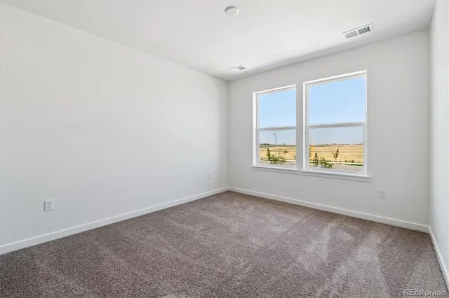 a view of kitchen with wooden floor and window