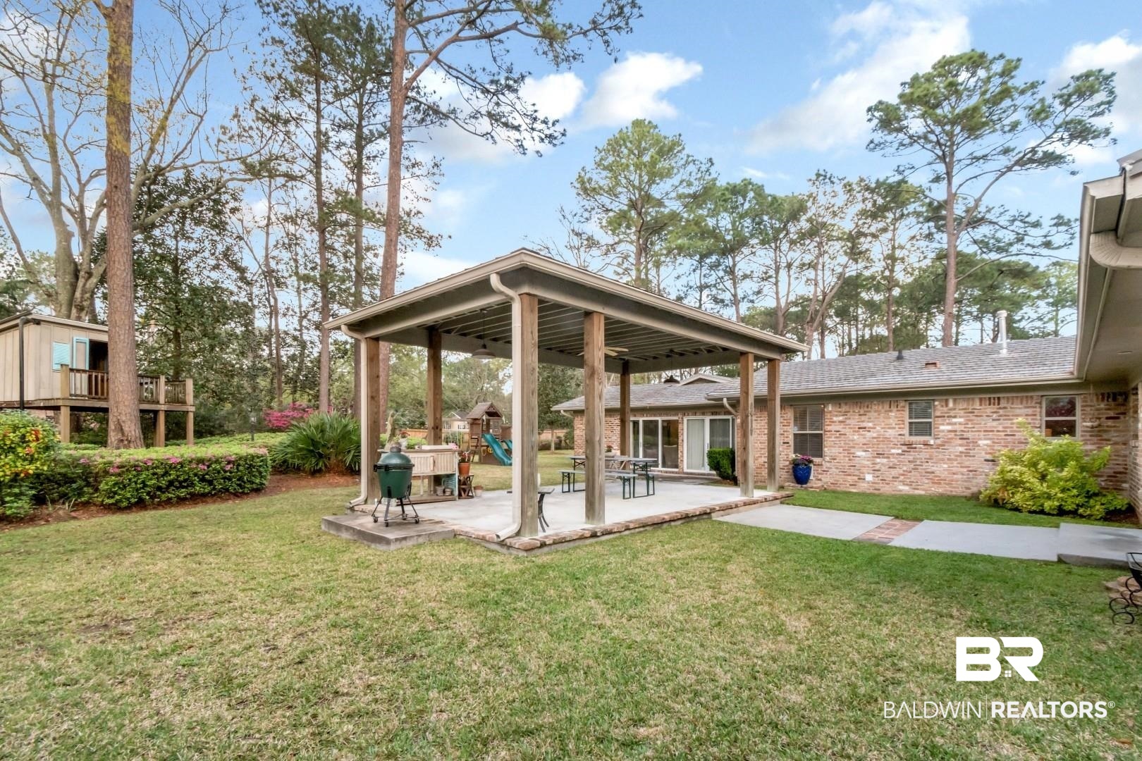 154 Fenwick Road Mobile, AL 36608 - Photo 34 of 48 Back of house featuring a patio area, a yard, brick siding, and a playground