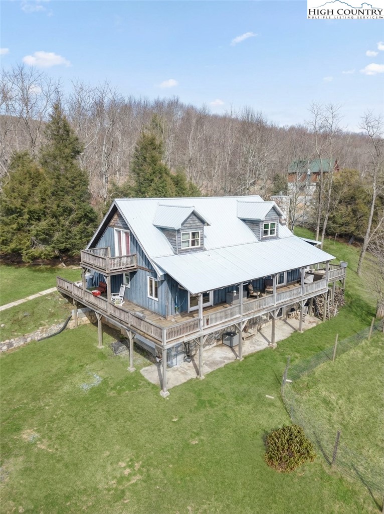 480 Schoolhouse Ridge Boone, NC 28607 - Photo 45 of 47 a view of a house with a yard balcony and sitting area