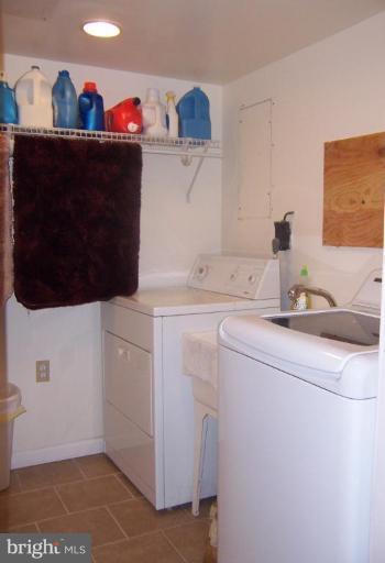 204 Burns Crossing Road Severn, MD 21144 - Photo 12 of 30 a utility room with dryer and washer