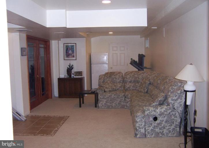 204 Burns Crossing Road Severn, MD 21144 - Photo 14 of 30 a living room with furniture and a fireplace