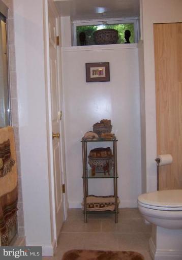 204 Burns Crossing Road Severn, MD 21144 - Photo 15 of 30 a bathroom with a toilet and a sink