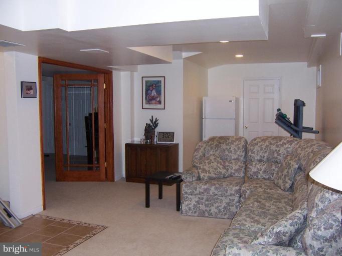 204 Burns Crossing Road Severn, MD 21144 - Photo 17 of 30 a living room with furniture and a fireplace