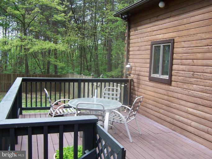 204 Burns Crossing Road Severn, MD 21144 - Photo 29 of 30 a view of deck with furniture and trees