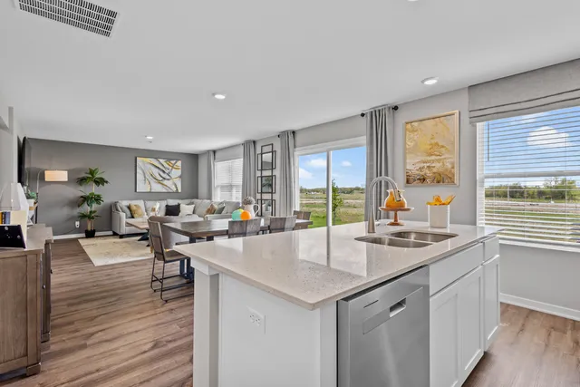 a very nice looking living room with wooden floor and furniture