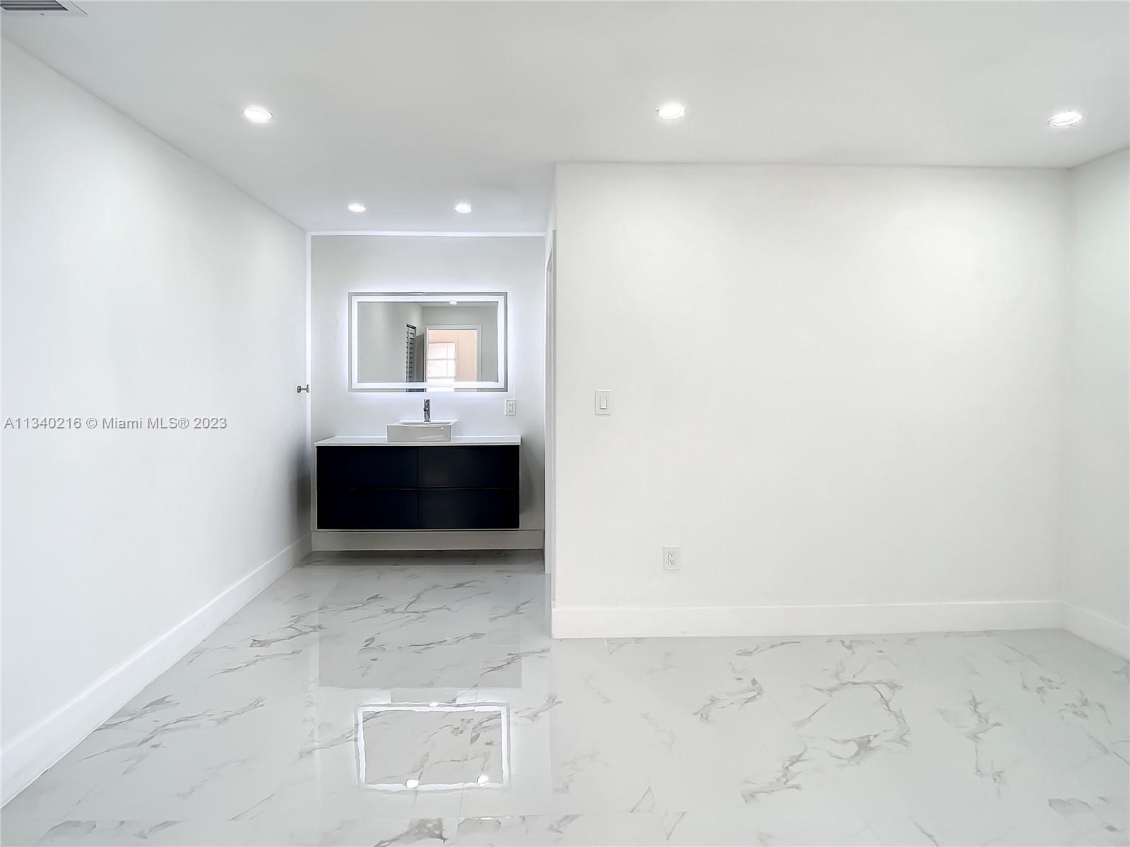 14031 Langley Place Davie, FL 33325 - Photo 11 of 27 a view of a room with a sink and a microwave