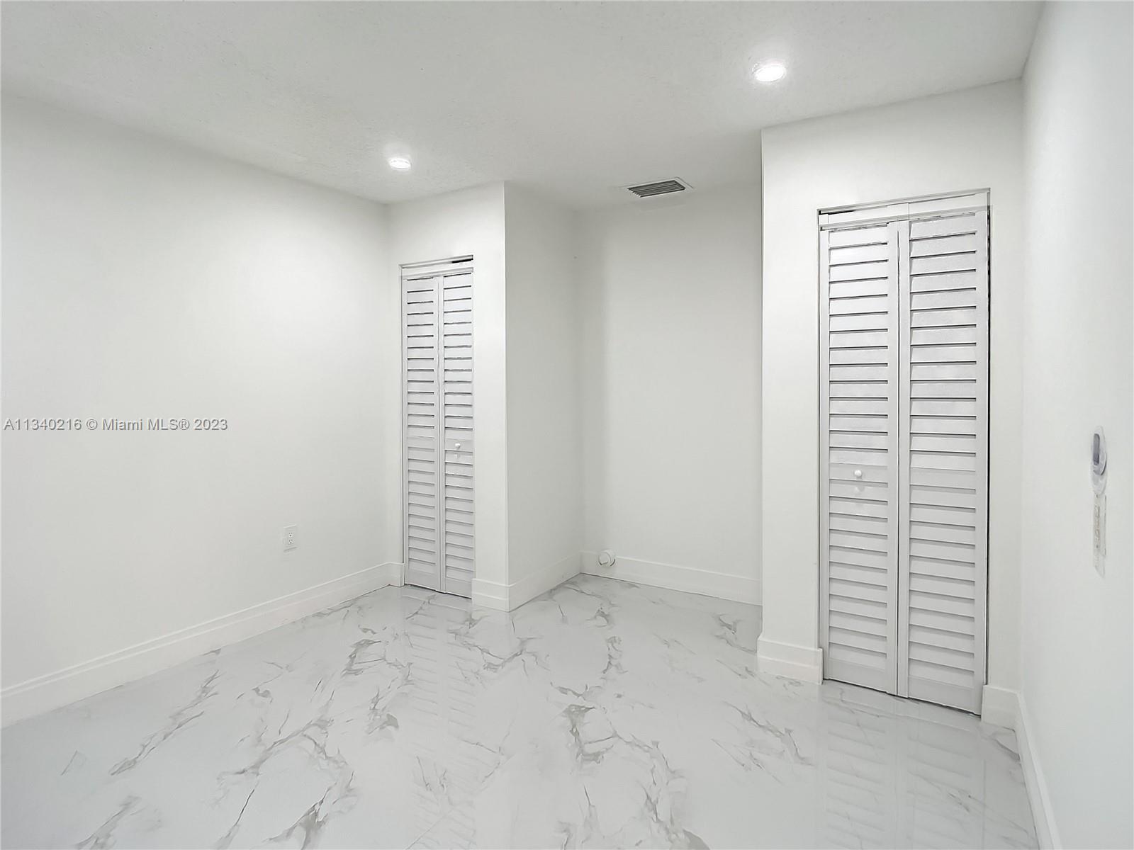 14031 Langley Place Davie, FL 33325 - Photo 14 of 27 an empty room with a window