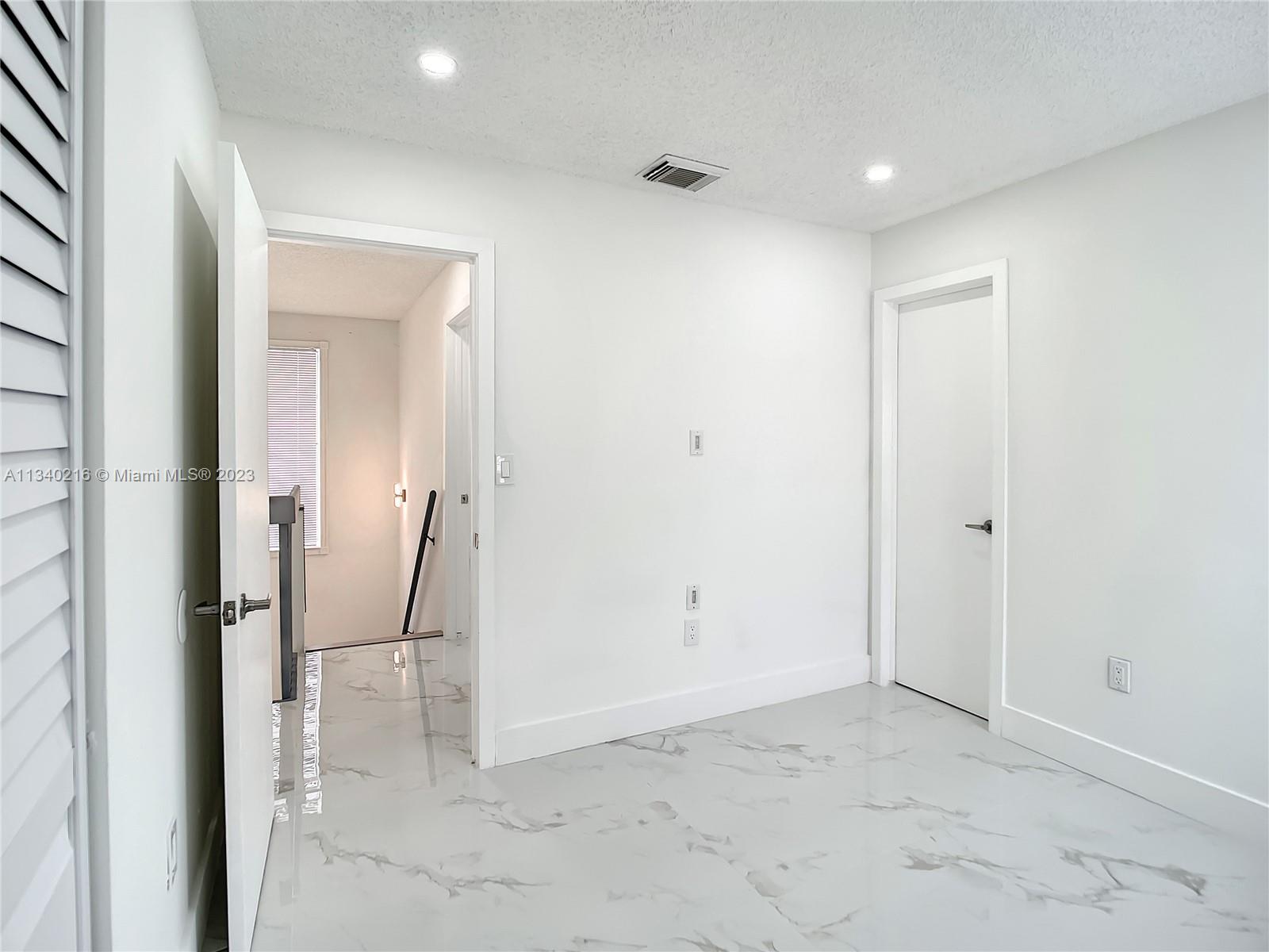 14031 Langley Place Davie, FL 33325 - Photo 23 of 27 a view of an empty room