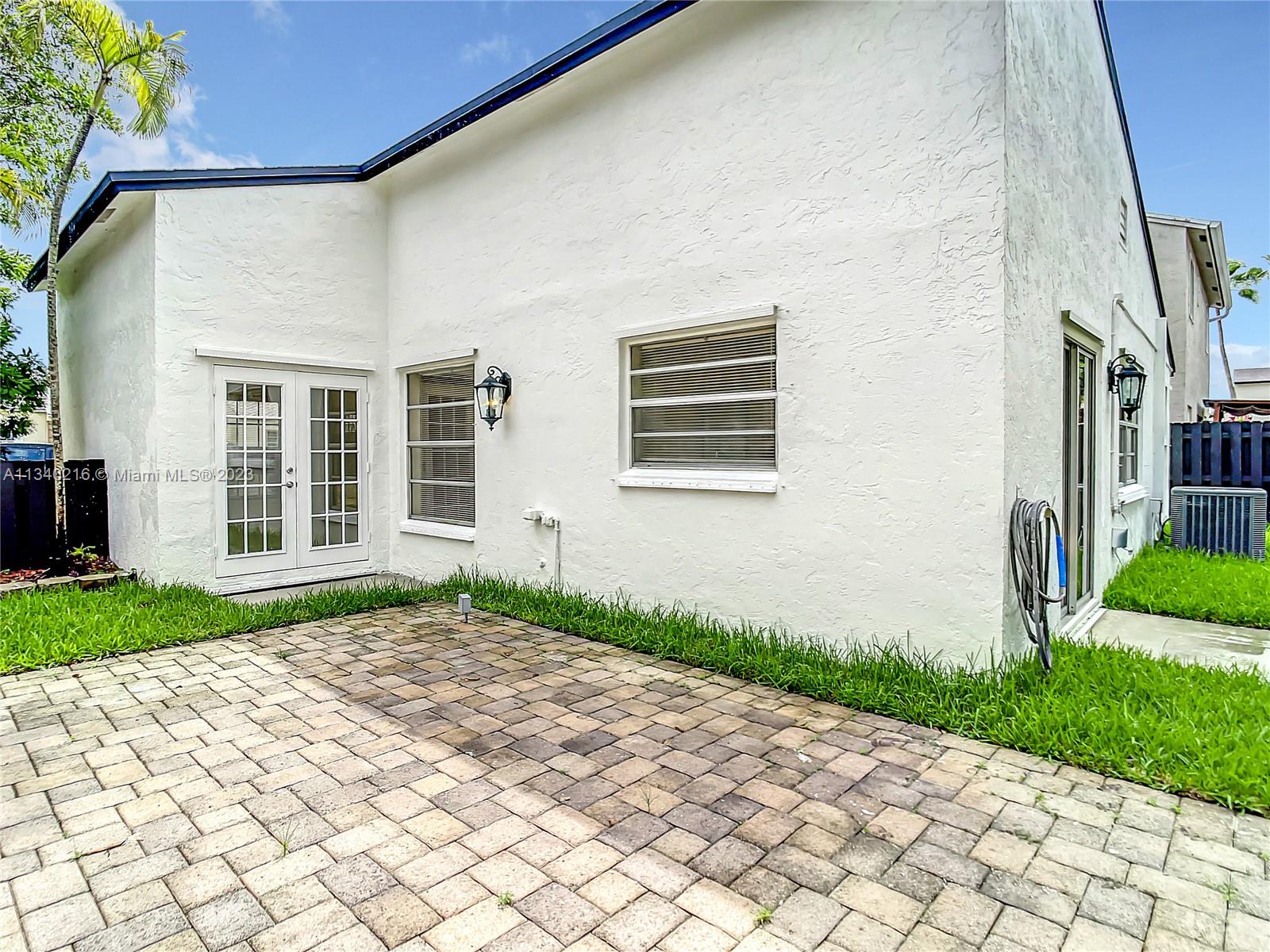 14031 Langley Place Davie, FL 33325 - Photo 26 of 27 a front view of a house with a yard