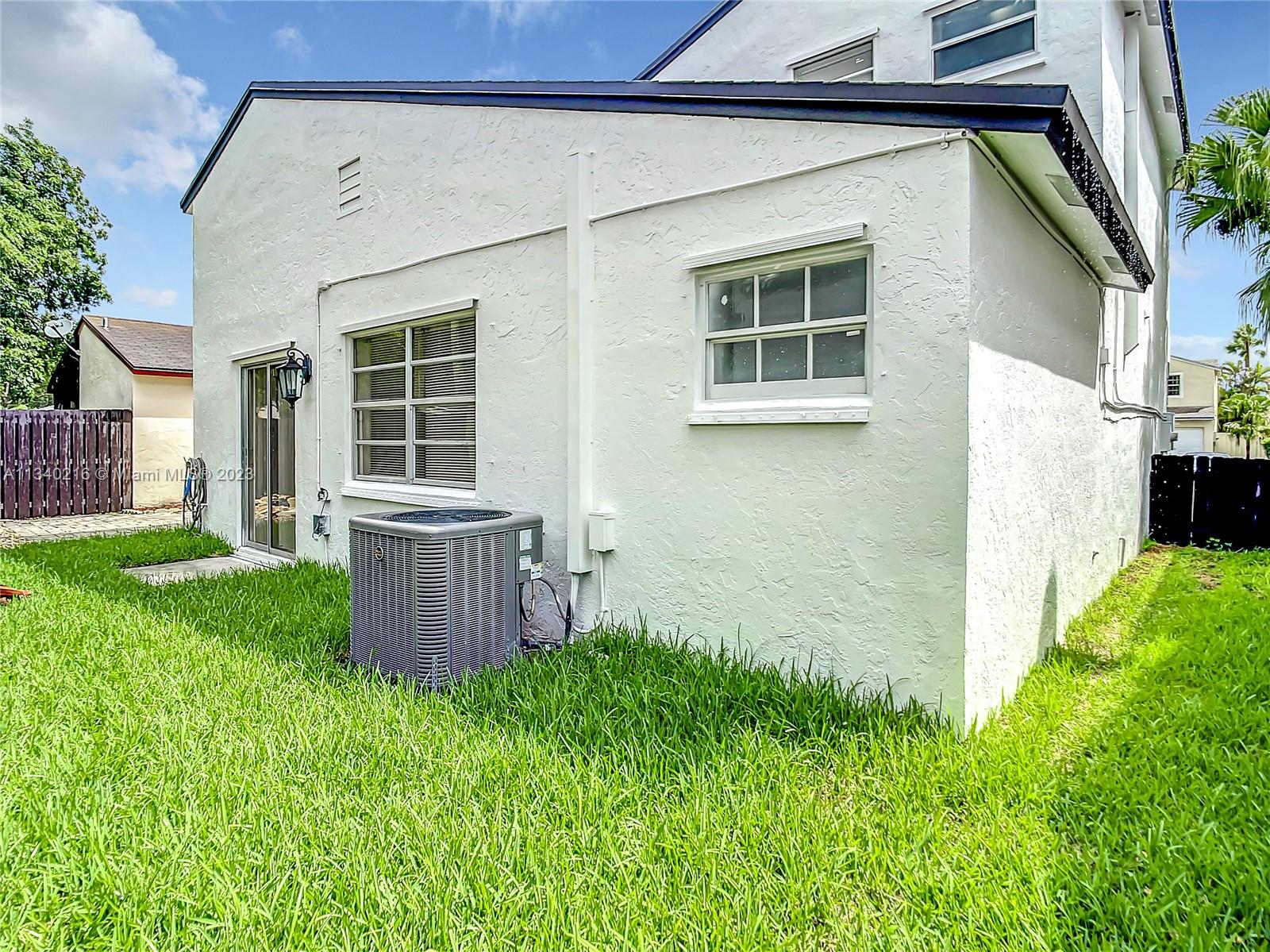 14031 Langley Place Davie, FL 33325 - Photo 27 of 27 a view of a backyard with plants and large trees