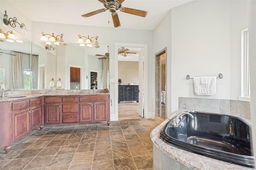 1237 Overlook Court Whitney, TX 76692 - Photo 10 of 20 a kitchen with a sink stove and cabinets