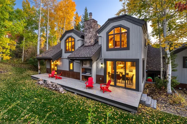 an outdoor view of a house with entertaining space
