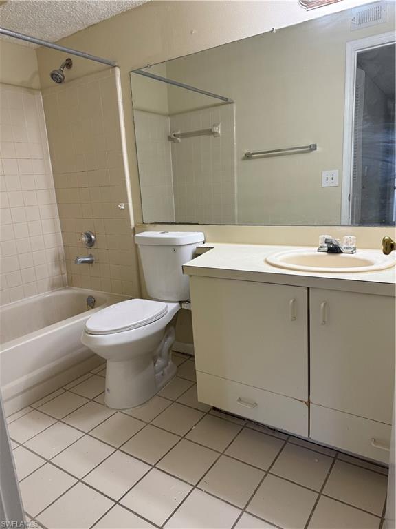 13631 Eagle Ridge Drive, Unit 226 Fort Myers, FL 33912 - Photo 11 of 19 a bathroom with a sink toilet and shower