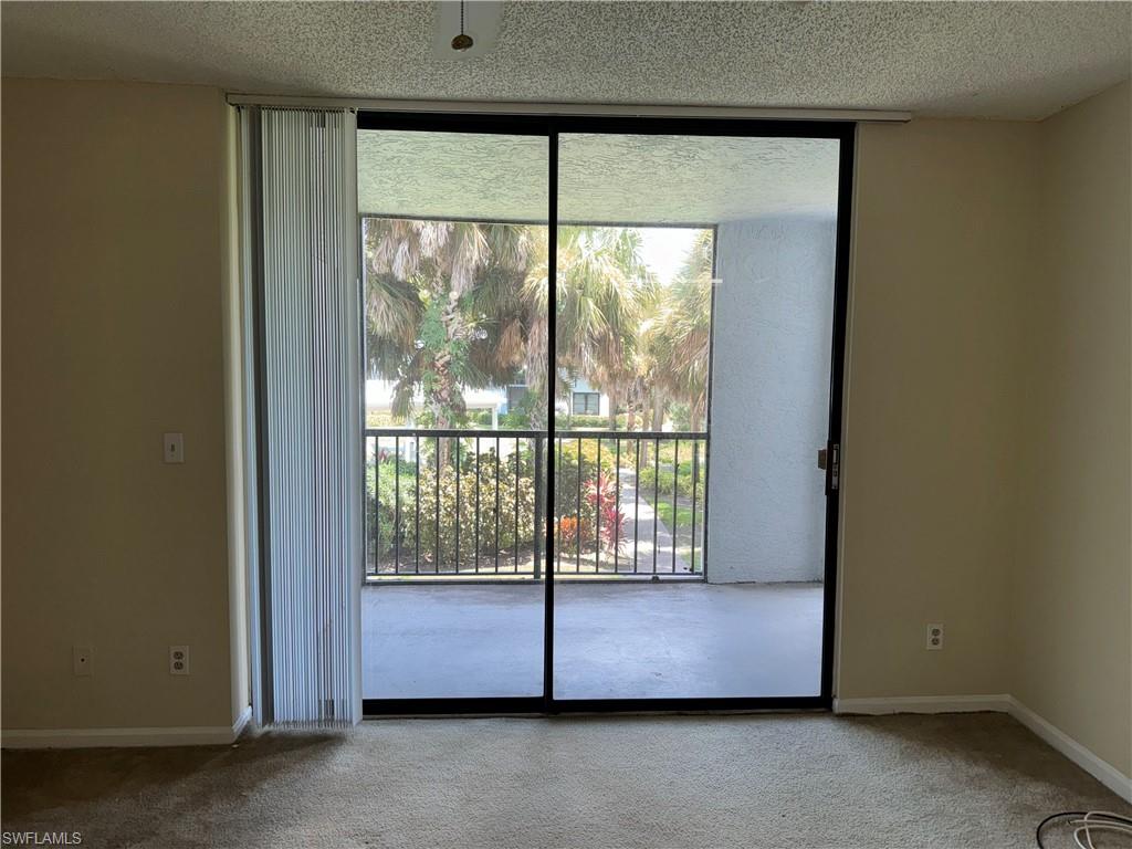 13631 Eagle Ridge Drive, Unit 226 Fort Myers, FL 33912 - Photo 2 of 19 a view of an empty room with a balcony