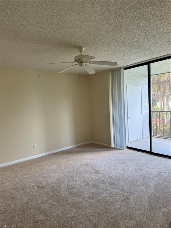 13631 Eagle Ridge Drive, Unit 226 Fort Myers, FL 33912 - Photo 6 of 19 a view of an empty room with a window