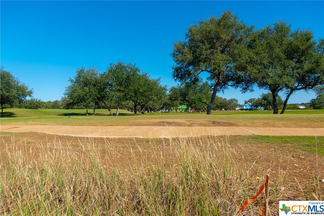 a view of a swimming pool and an outdoor space