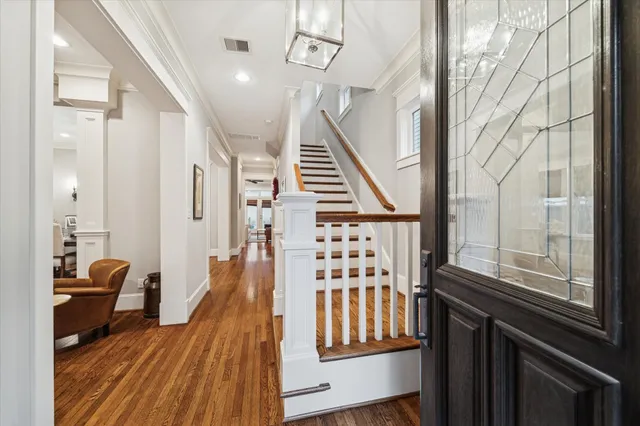 a living room with furniture window and a potted plant