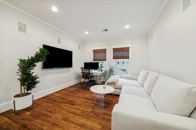 a workspace with furniture and a potted plant