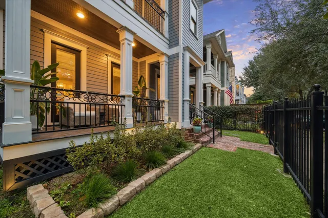 a view of an chairs and flower in the balcony