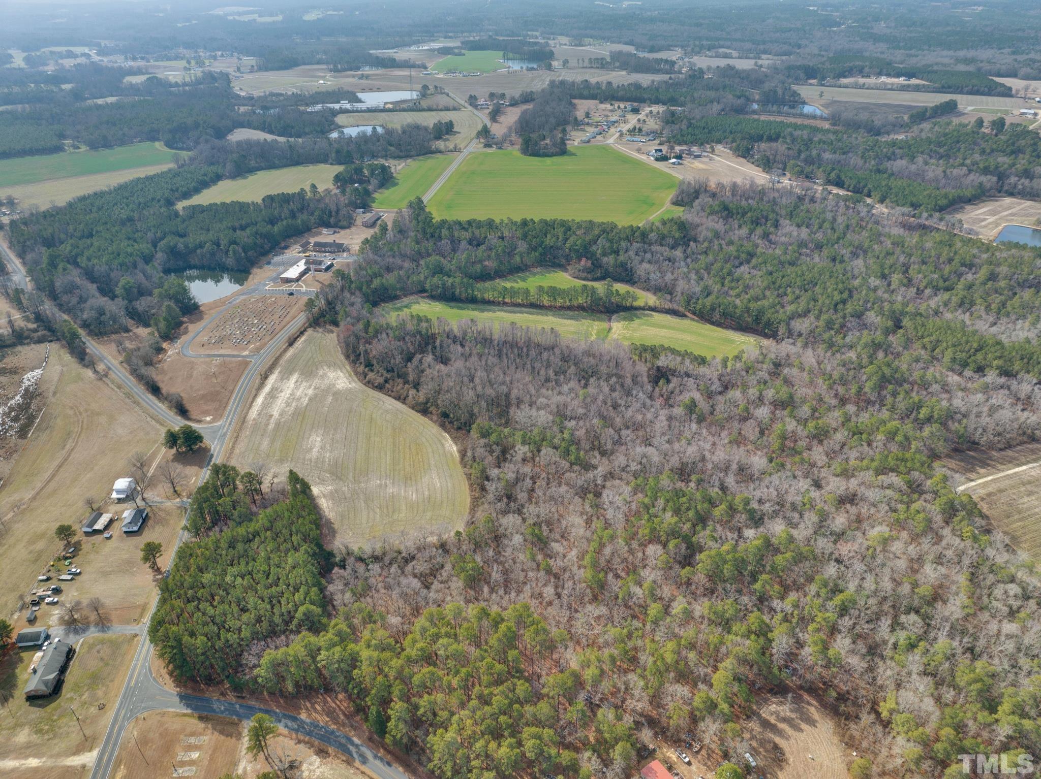 0 Spring Hill Church Road Lillington, NC 27546 - Photo 5 of 22 a aerial view of a house with a yard and greenery