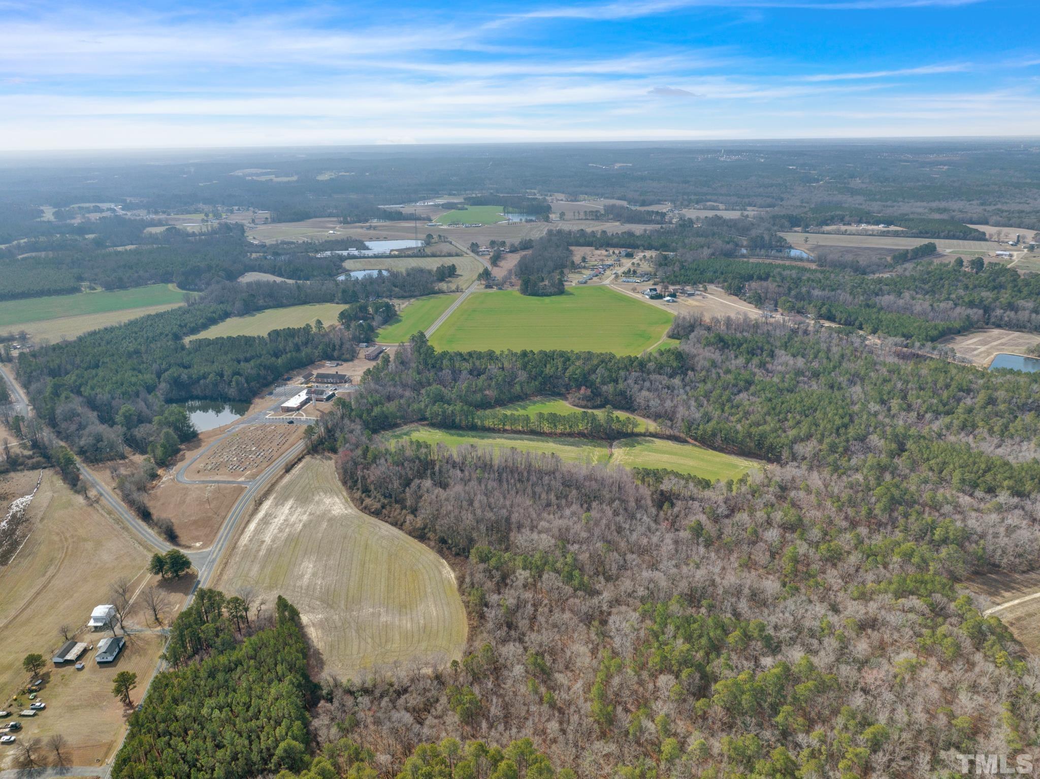0 Spring Hill Church Road Lillington, NC 27546 - Photo 6 of 22 an aerial view of residential houses with outdoor space and trees