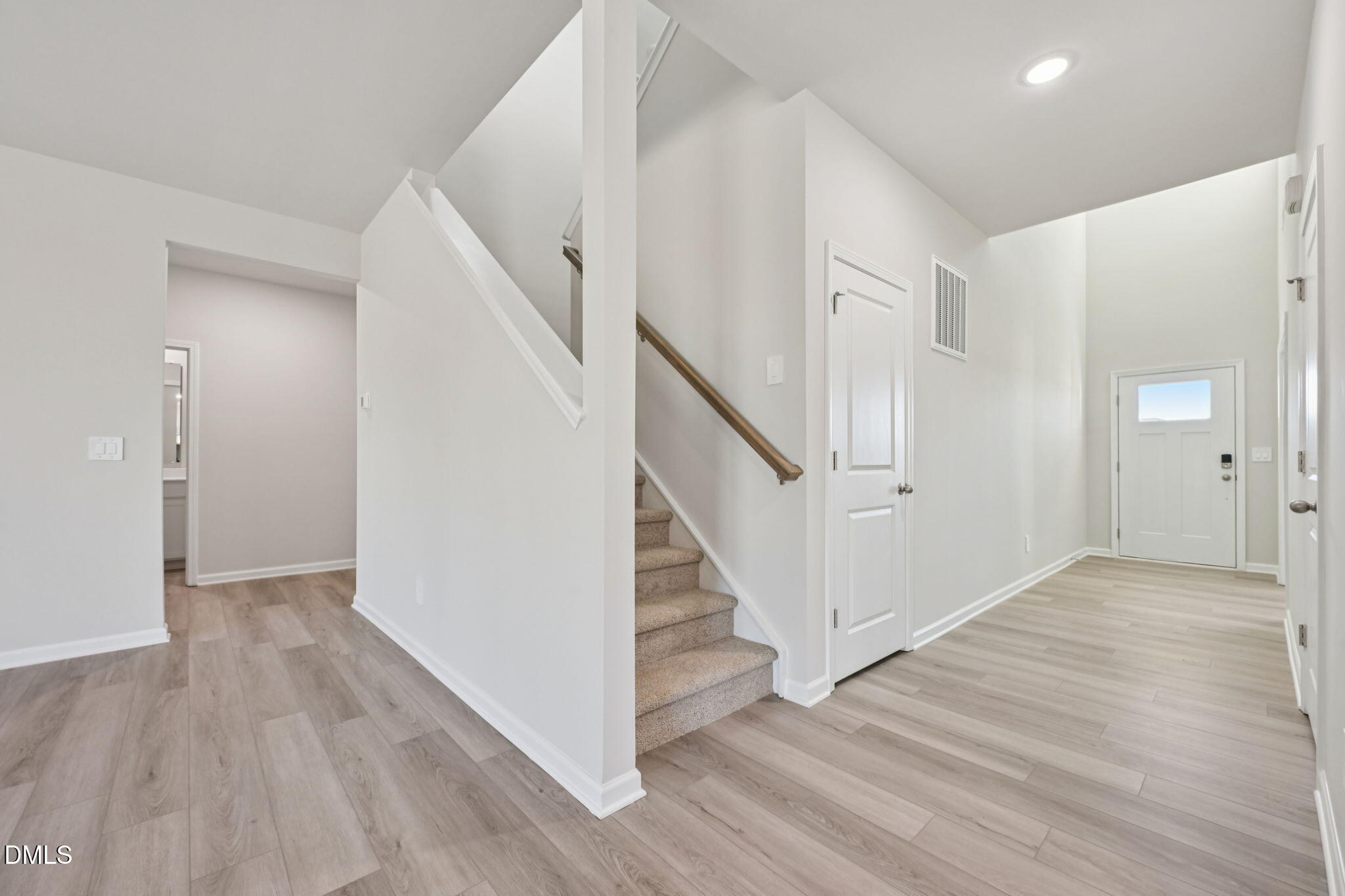 2145 Topsail Road Durham, NC 27703 - Photo 5 of 49 a view of a hallway with wooden floor and entryway