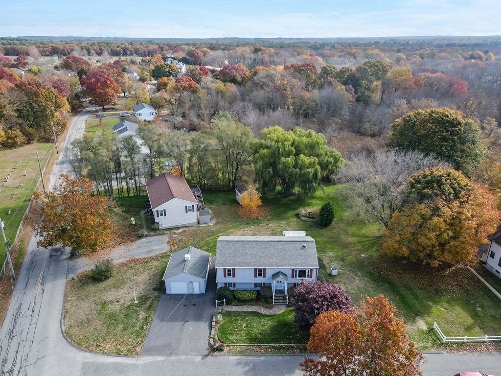 83 Cherry Street Taunton, MA 02780 - Photo 1 of 42 an aerial view of a house with a garden and lake view