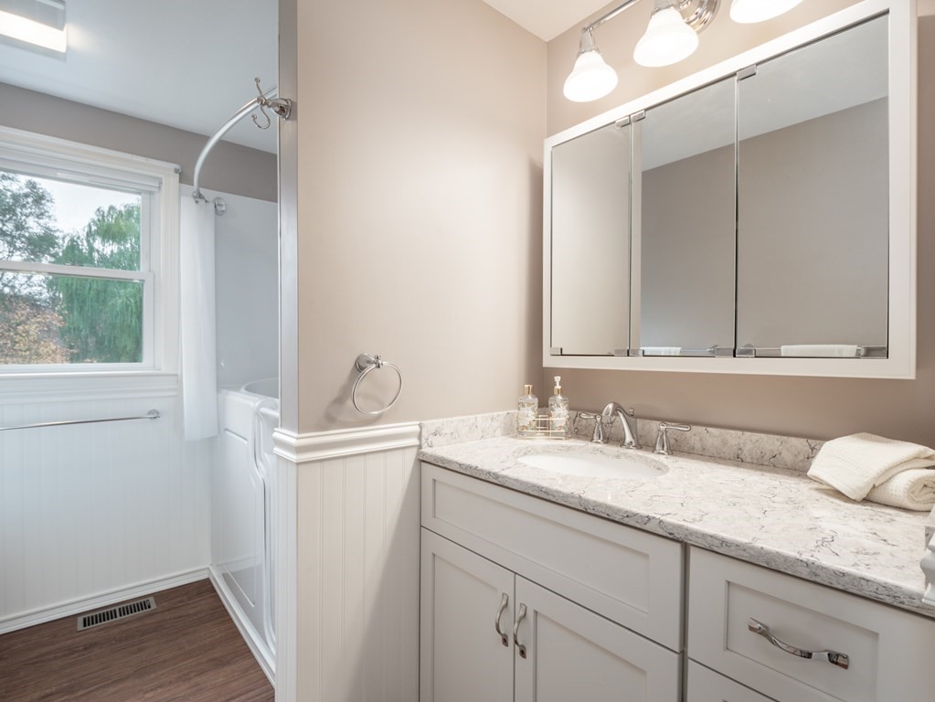 83 Cherry Street Taunton, MA 02780 - Photo 13 of 42 a bathroom with a granite countertop sink and a mirror