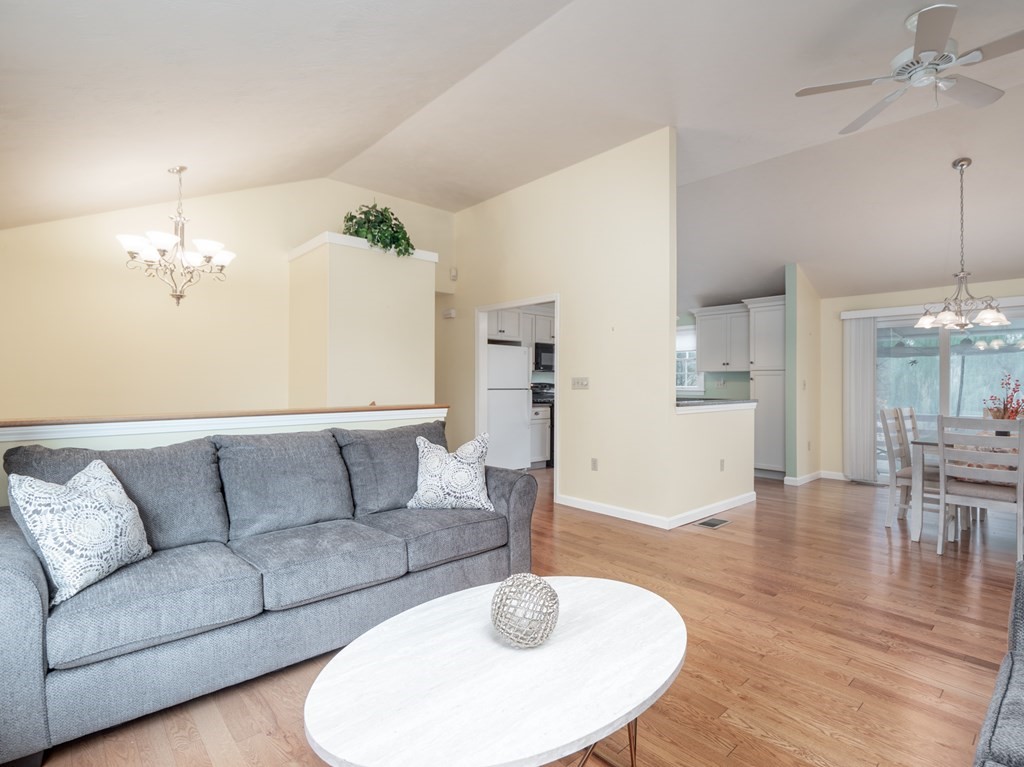 83 Cherry Street Taunton, MA 02780 - Photo 16 of 42 a living room with furniture and a dining table