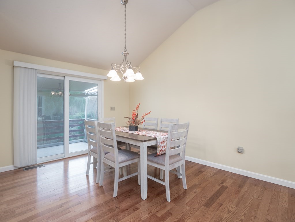 83 Cherry Street Taunton, MA 02780 - Photo 18 of 42 a view of a dining room with furniture wooden floor and chandelier