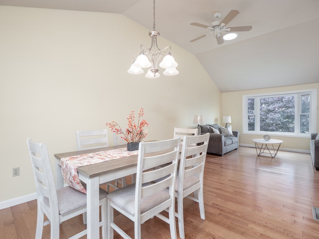 83 Cherry Street Taunton, MA 02780 - Photo 19 of 42 a view of a dining room with furniture a chandelier and wooden floor