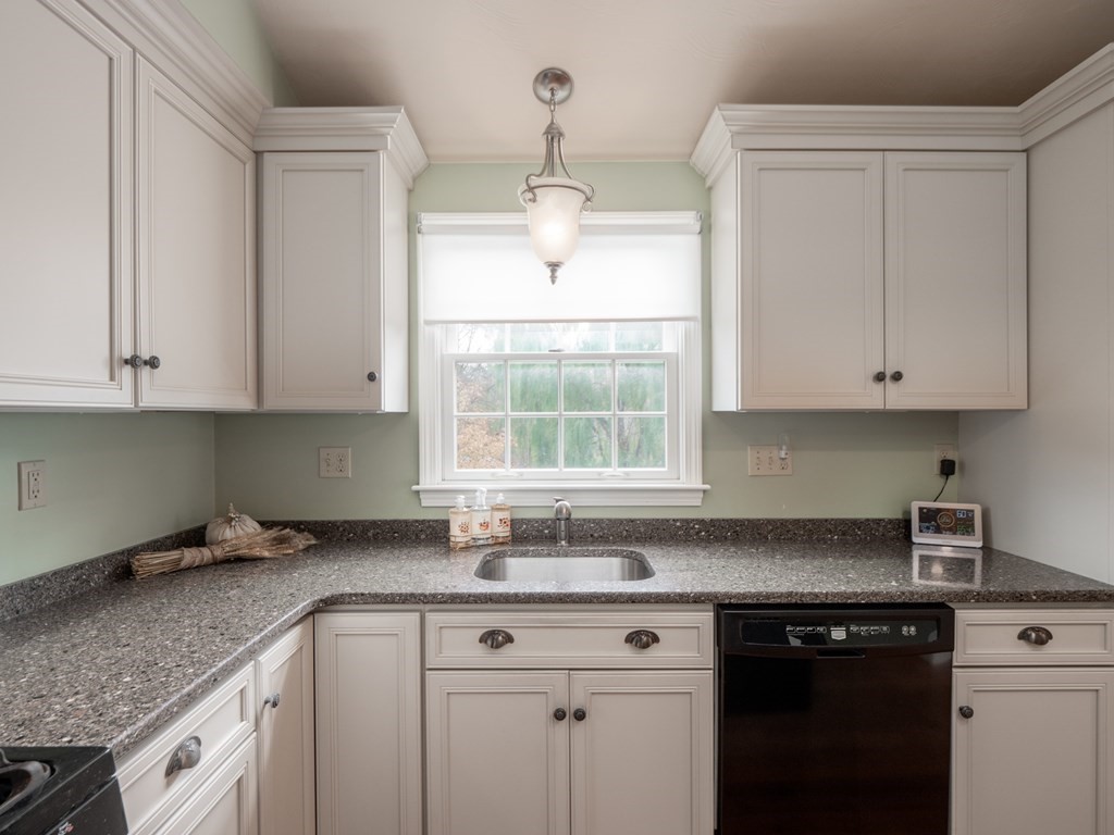 83 Cherry Street Taunton, MA 02780 - Photo 22 of 42 a kitchen with granite countertop white cabinets white appliances and a sink