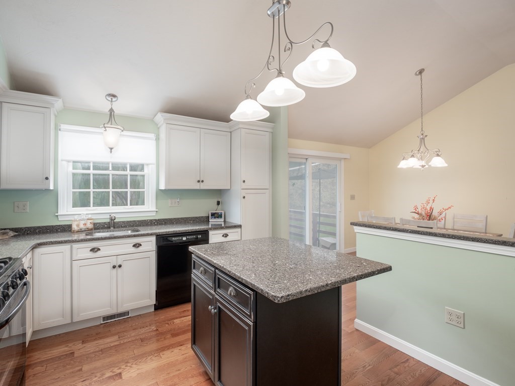 83 Cherry Street Taunton, MA 02780 - Photo 23 of 42 a kitchen with granite countertop a sink a counter space appliances and cabinets
