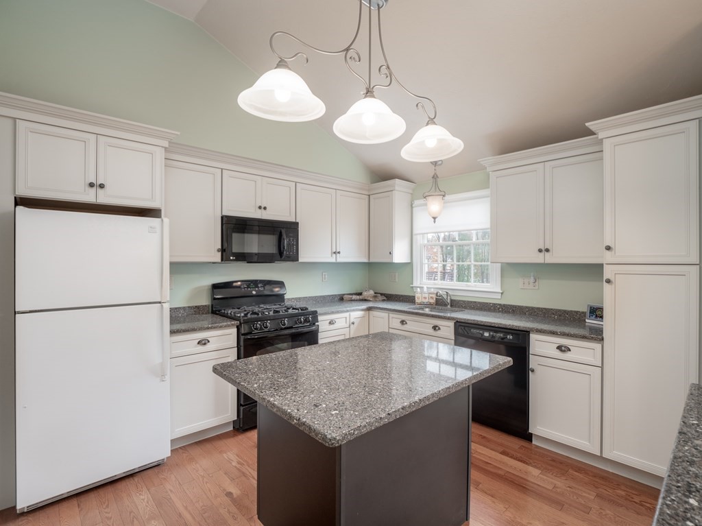 83 Cherry Street Taunton, MA 02780 - Photo 24 of 42 a kitchen with a center island white cabinets and stainless steel appliances