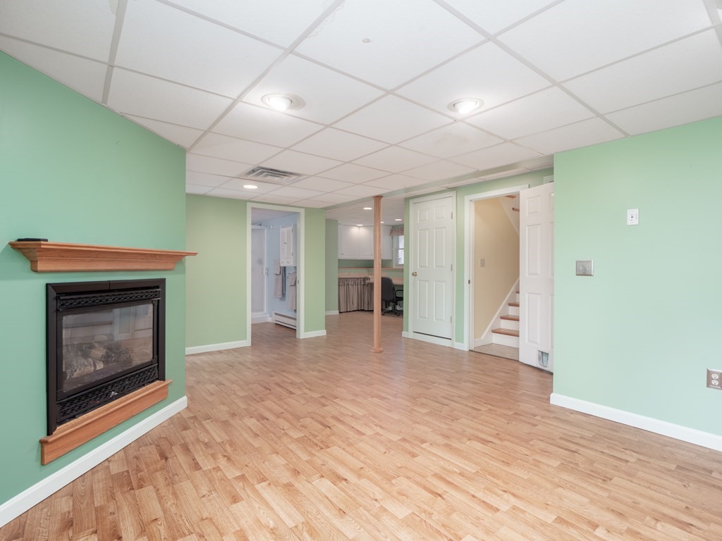 83 Cherry Street Taunton, MA 02780 - Photo 27 of 42 a view of an empty room with a fireplace