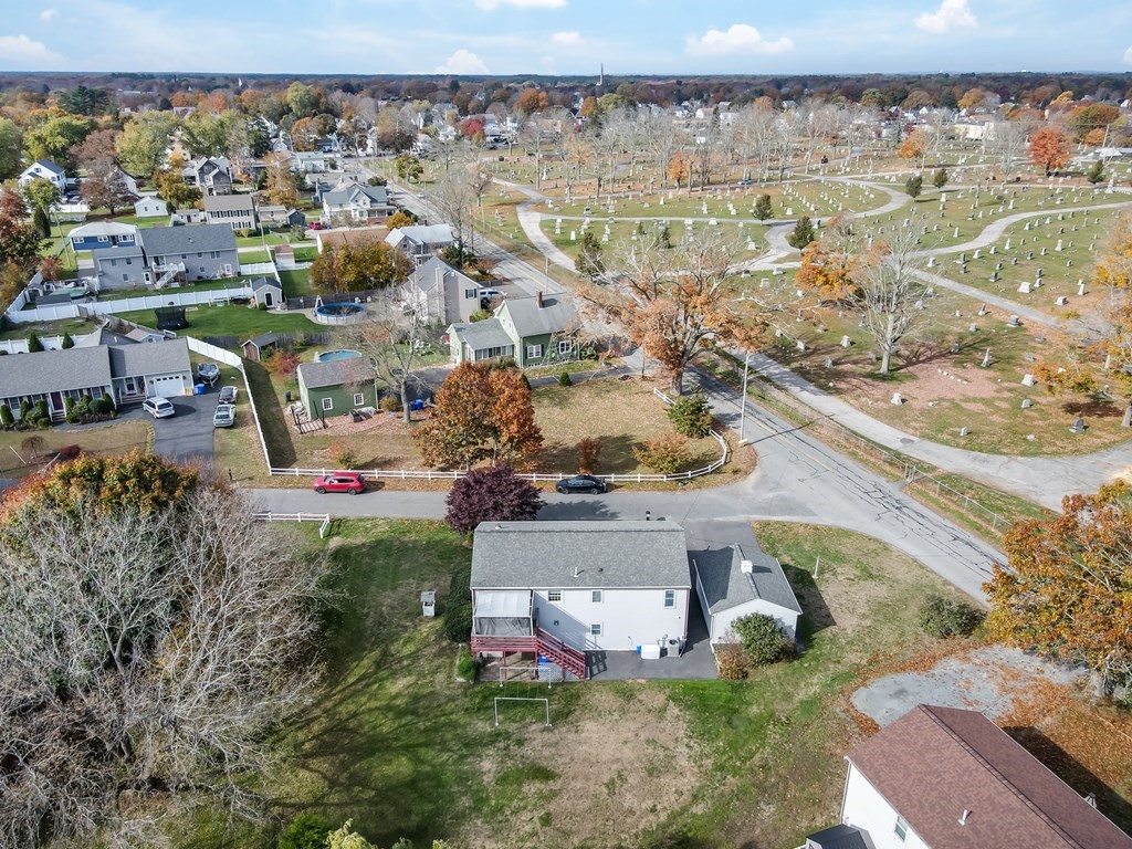 83 Cherry Street Taunton, MA 02780 - Photo 3 of 42 an aerial view of a house with a yard basket ball court and outdoor seating