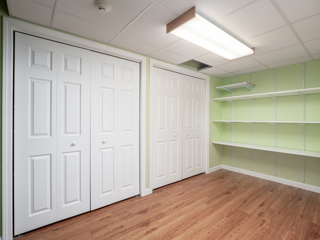 83 Cherry Street Taunton, MA 02780 - Photo 35 of 42 a view of an empty room with a window and wooden floor