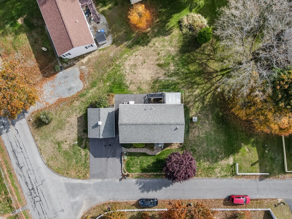 83 Cherry Street Taunton, MA 02780 - Photo 4 of 42 an aerial view of a house with a yard and large tree