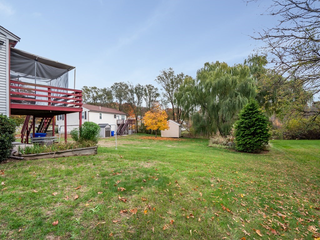 83 Cherry Street Taunton, MA 02780 - Photo 41 of 42 a front view of a house with a yard