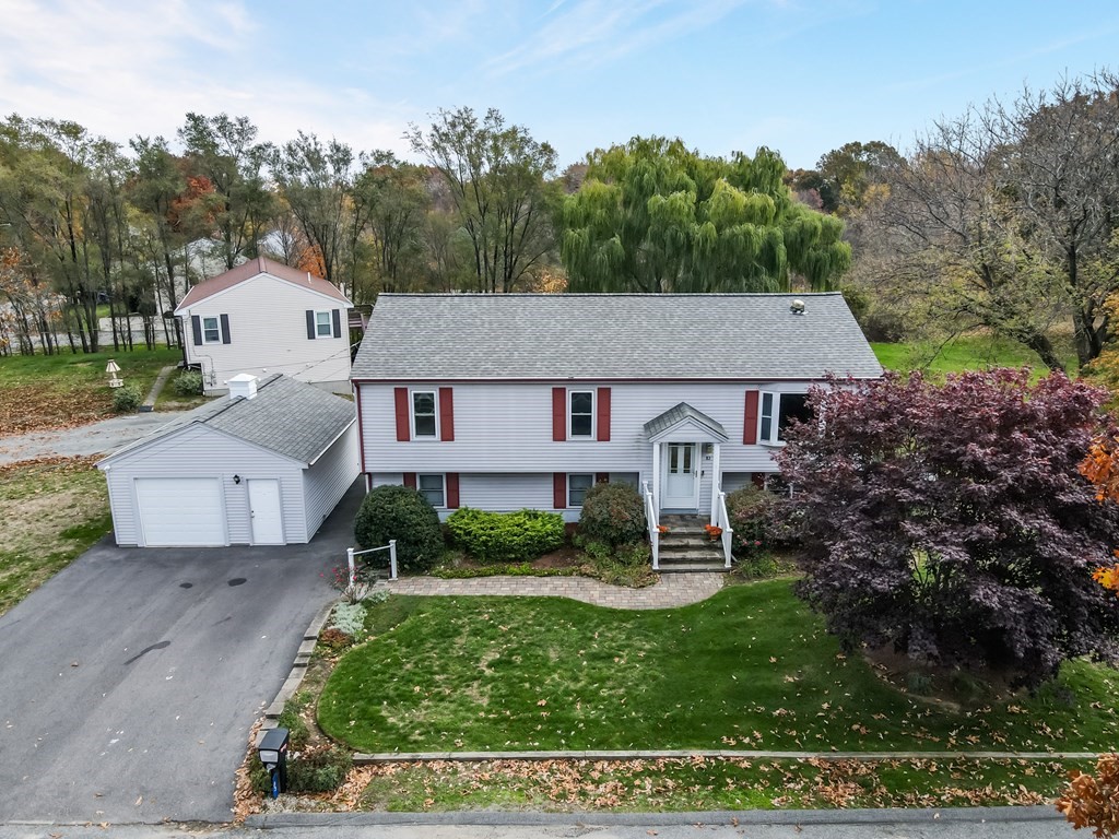 83 Cherry Street Taunton, MA 02780 - Photo 5 of 42 a aerial view of a house with a yard plants and large tree